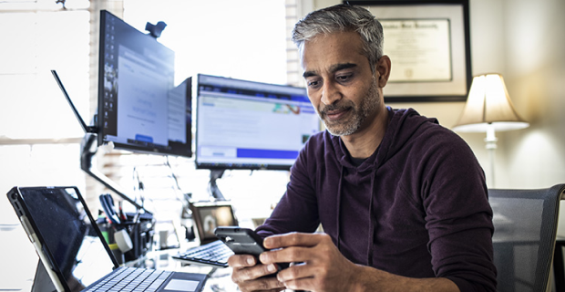 Business consultant working on a smartphone.