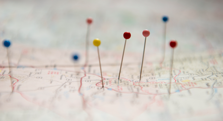 Close-up of a map with multiple pins marking different locations, symbolizing widespread mortgage services and market reach.