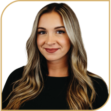 Kym Campo smiling confidently in a professional headshot.