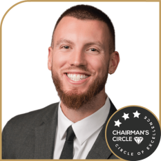Austin Irwin – Chairman’s Circle Mortgage Advisor at Directors Mortgage Austin Irwin smiling in a suit, featuring a Chairman’s Circle badge.
